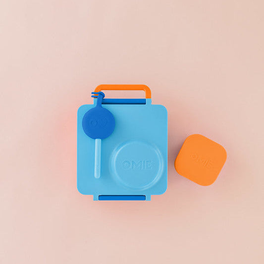 Blue and orange container on a beige background