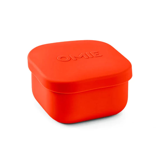 A collection of colorful silicone snack containers in various shades of red, orange, green, blue, and purple, designed to be used with an OmieBox.