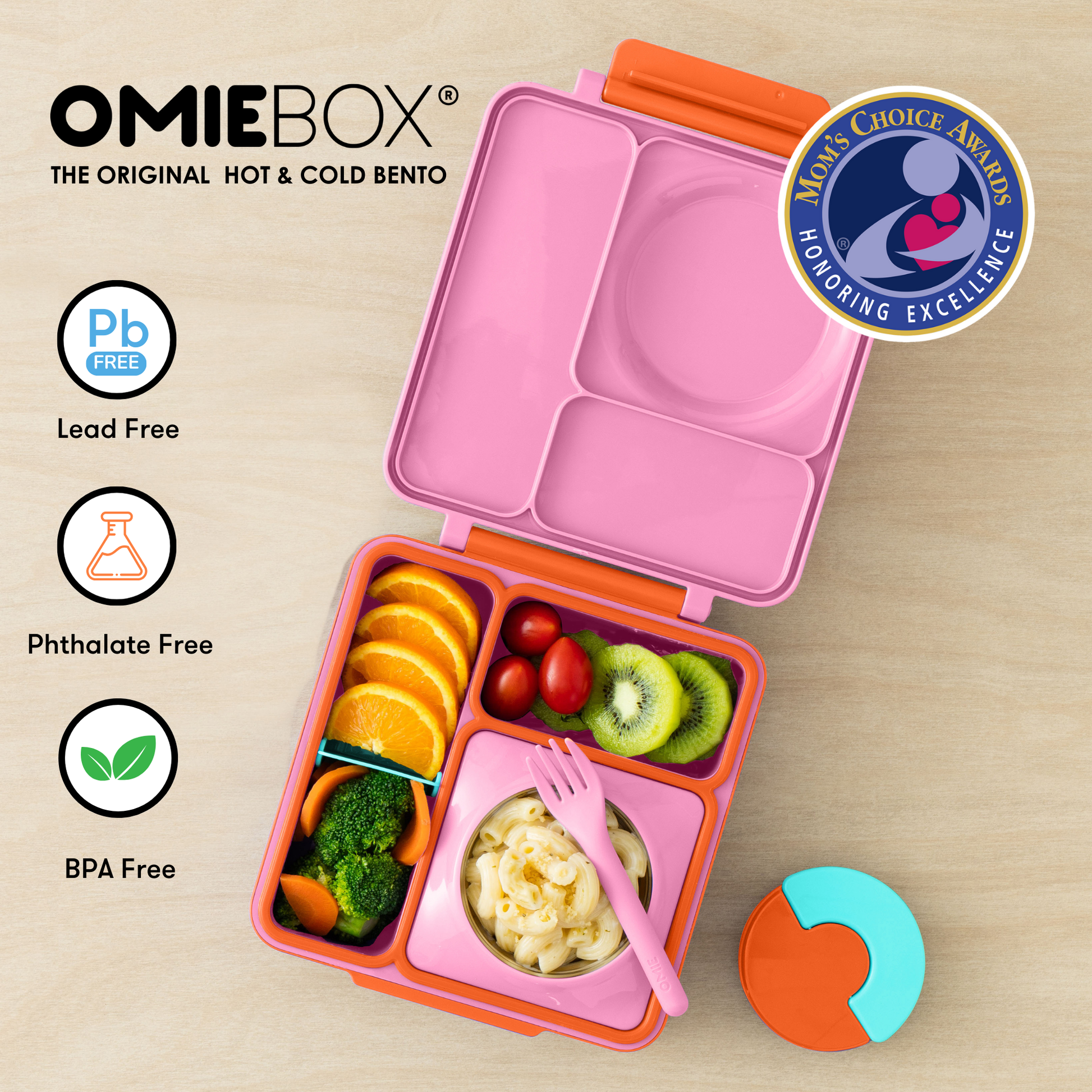 Pink bento box with compartments filled with food on a wooden surface.