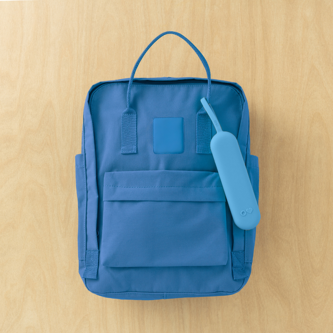 Blue backpack on a wooden surface