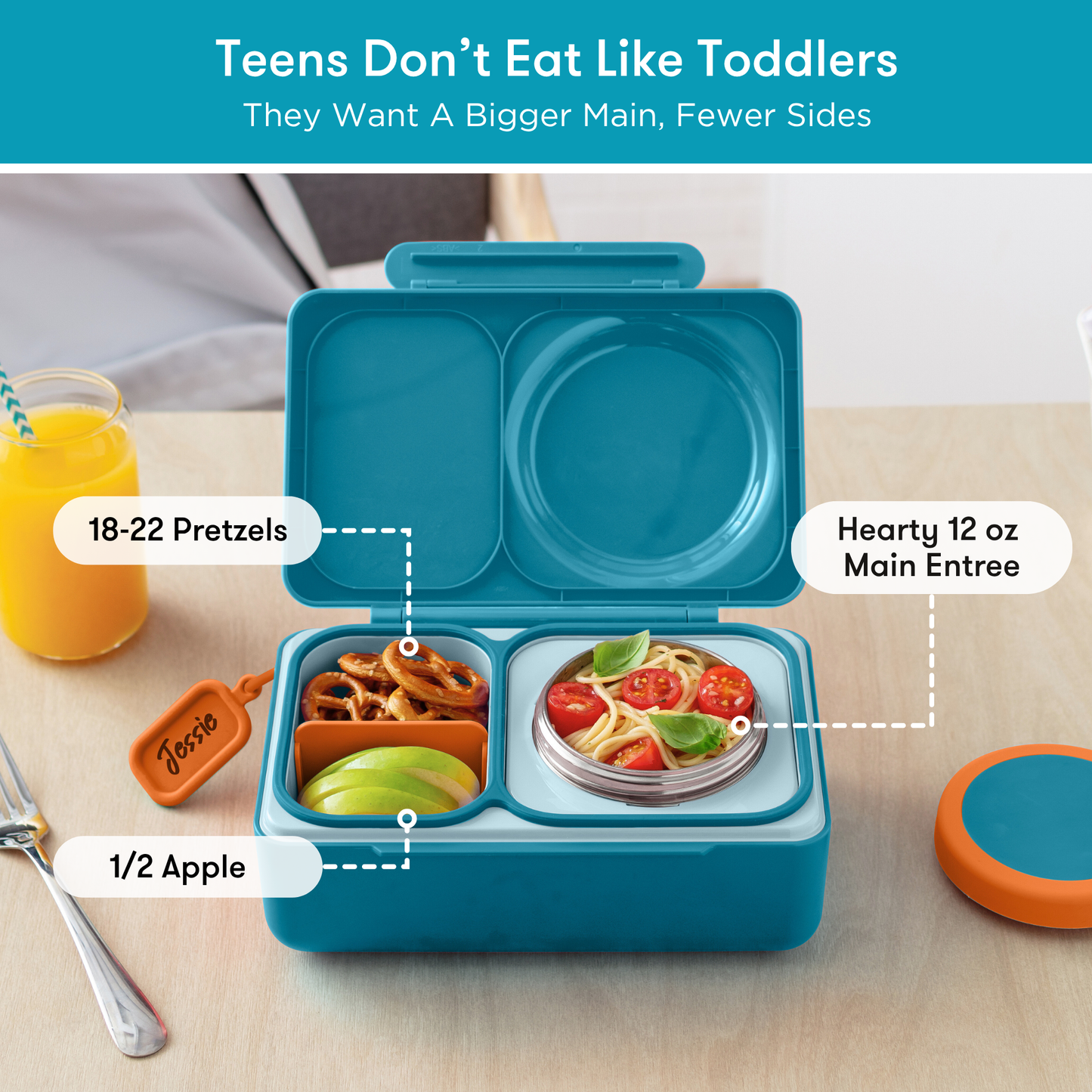 Blue bento box with compartments containing food items on a table.