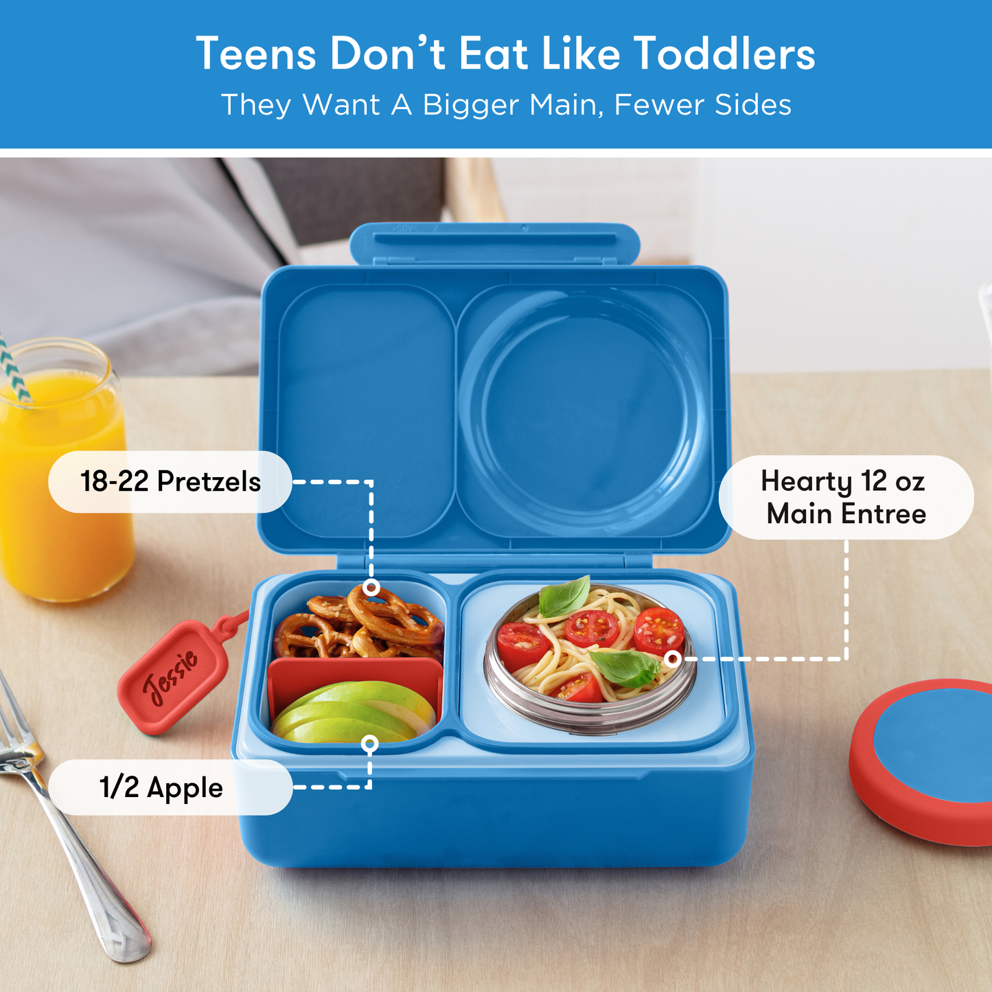 Blue bento box with compartments labeled for food items on a table.