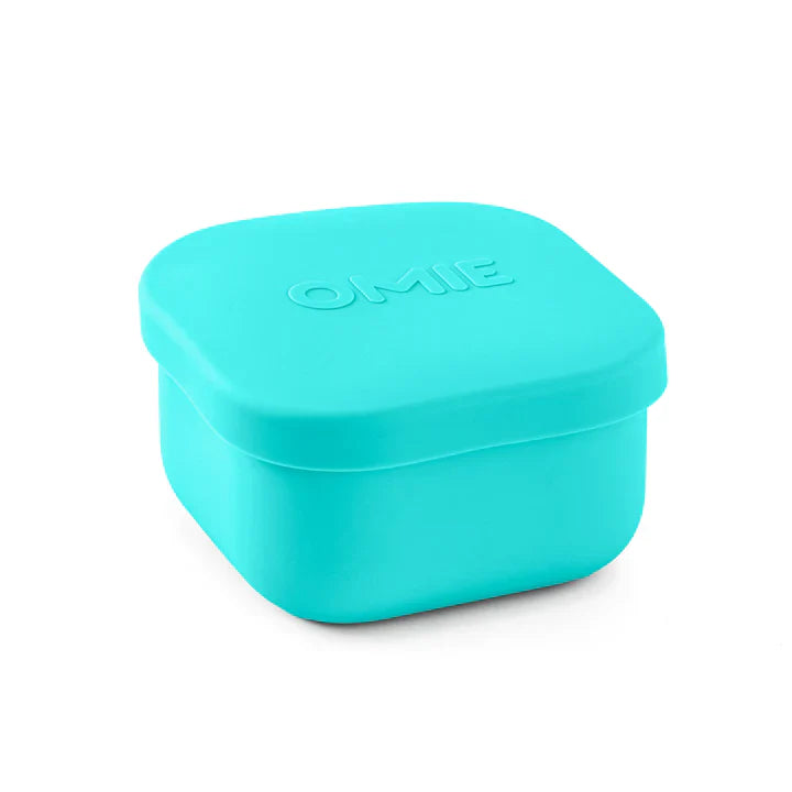 A collection of colorful silicone snack containers in various shades of red, orange, green, blue, and purple, designed to be used with an OmieBox.