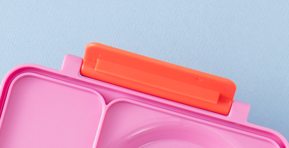 A blue replacement latch for the OmieBox food storage container.