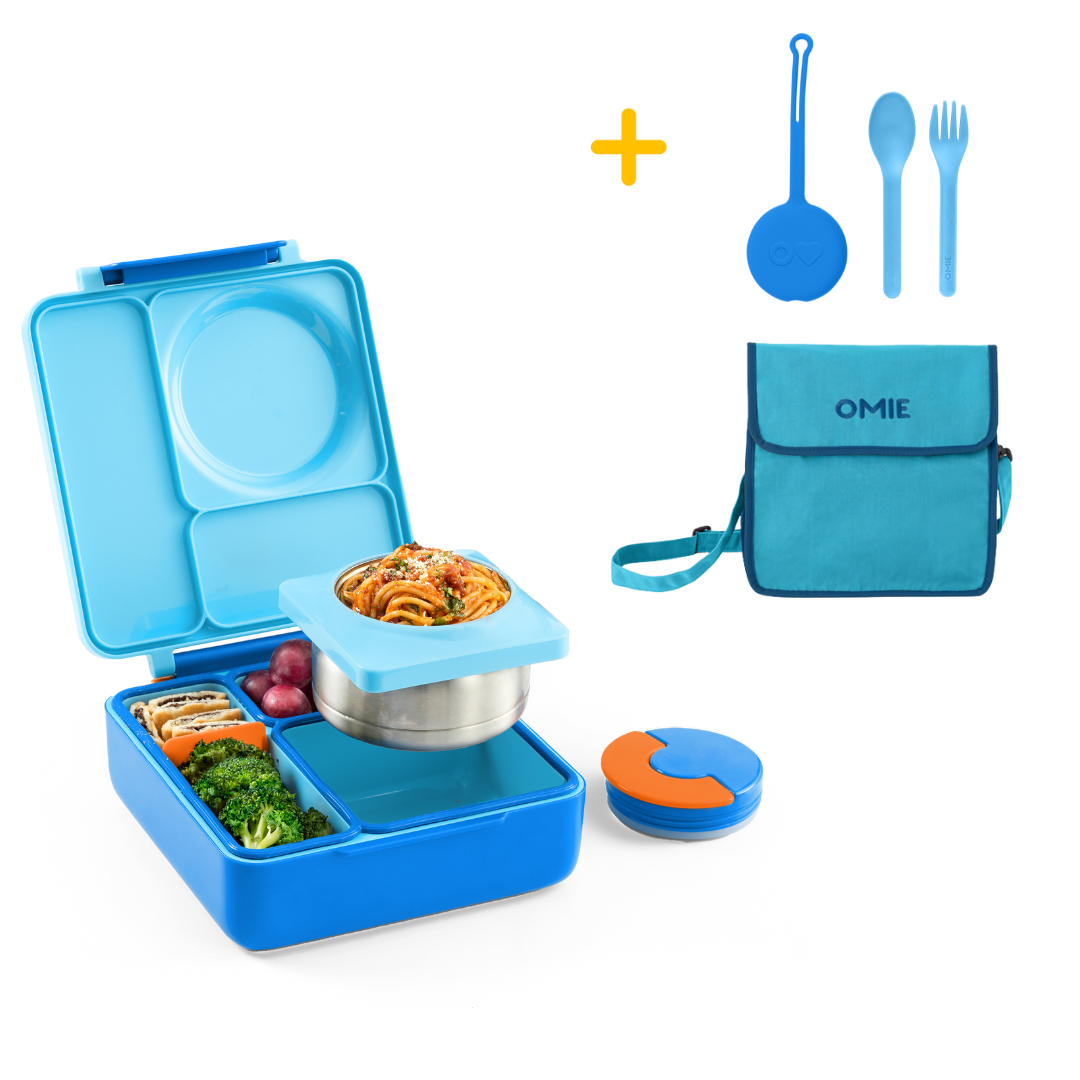 Blue bento box with food compartments, a lunch bag, and utensils on a white background.