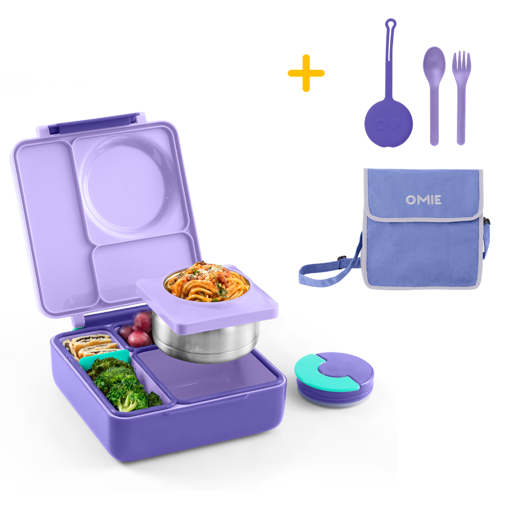Purple bento box with food compartments, a bag, utensils, and a container on a white background.